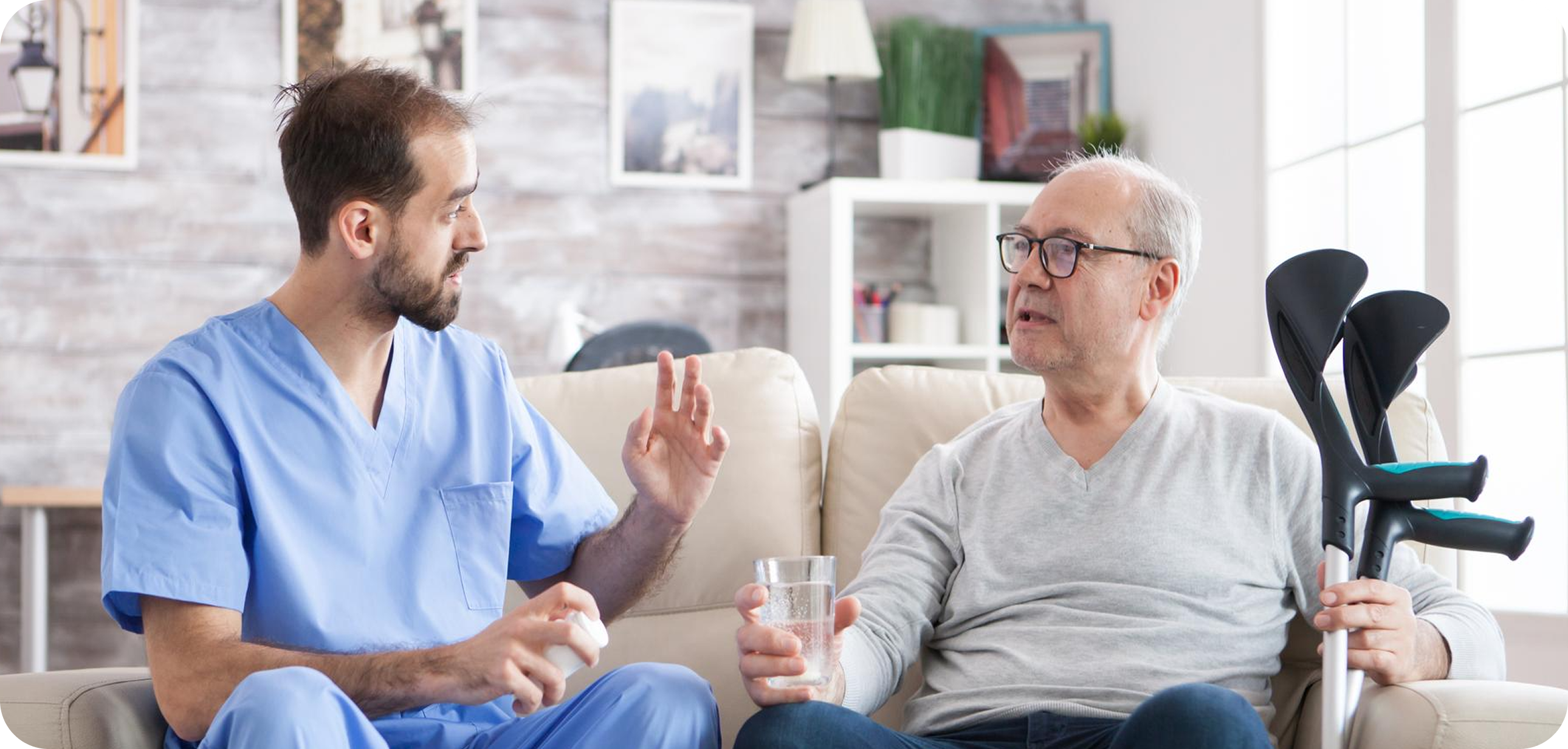 A nurse talking warmly with a resident at home