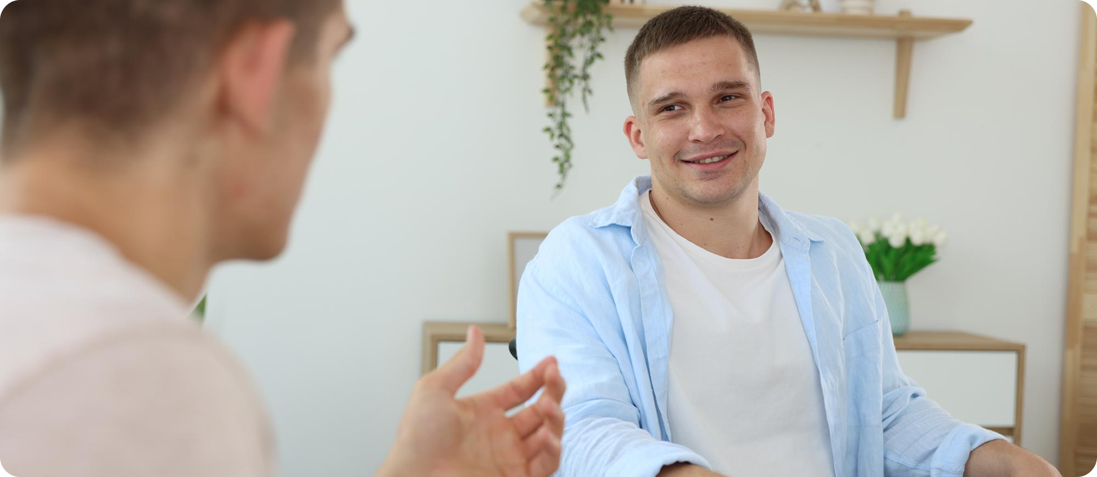 A caregiver sharing a warm moment with a smiling resident