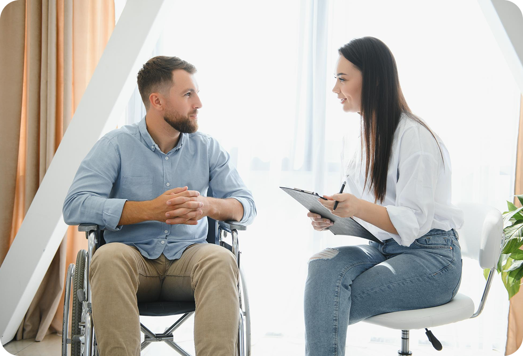 A caregiver encouraging a smiling resident using a walker