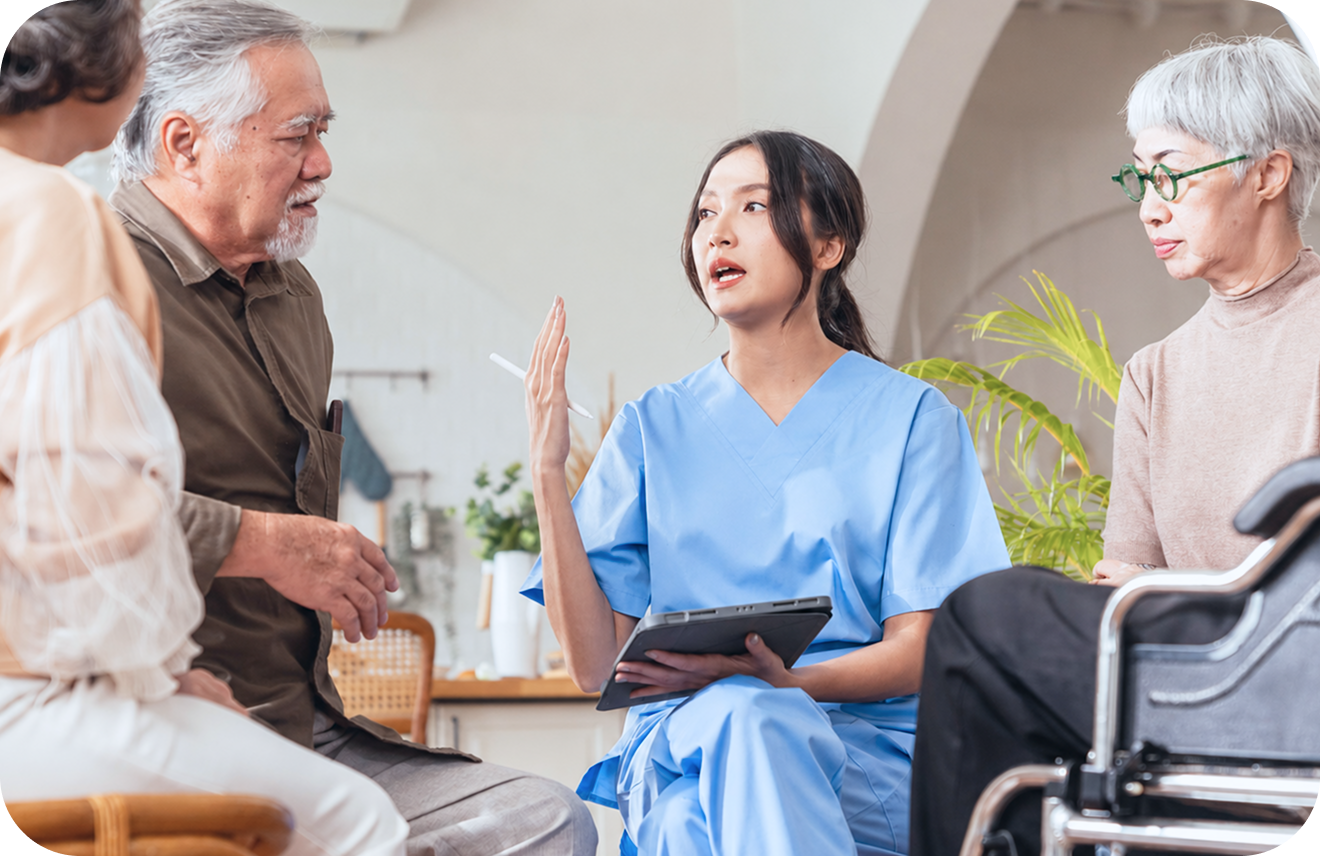 A caregiver engaging warmly with residents
