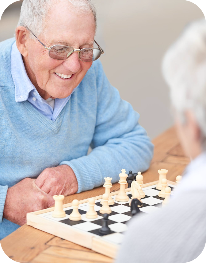 A resident enjoying a game of chess